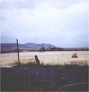 Guarding a Huey chopper while it was on the ground